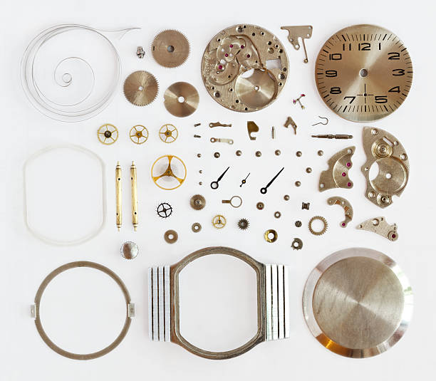 Watch components flat laid on a white background