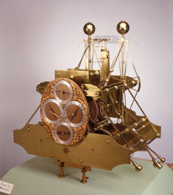 A gold marine chronometer with four subdials
