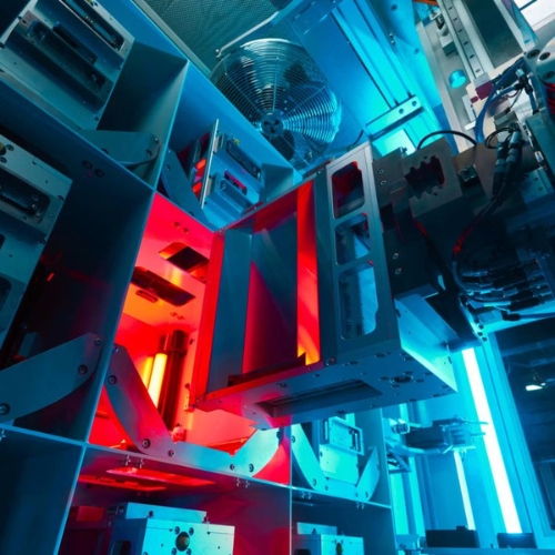 Testing machinery in a blue and red lit room