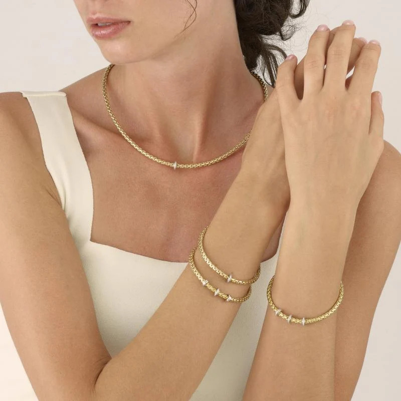 18K YELLOW GOLD STRETCH SPRING BRACELET WITH 0.10CT DIAMOND RING